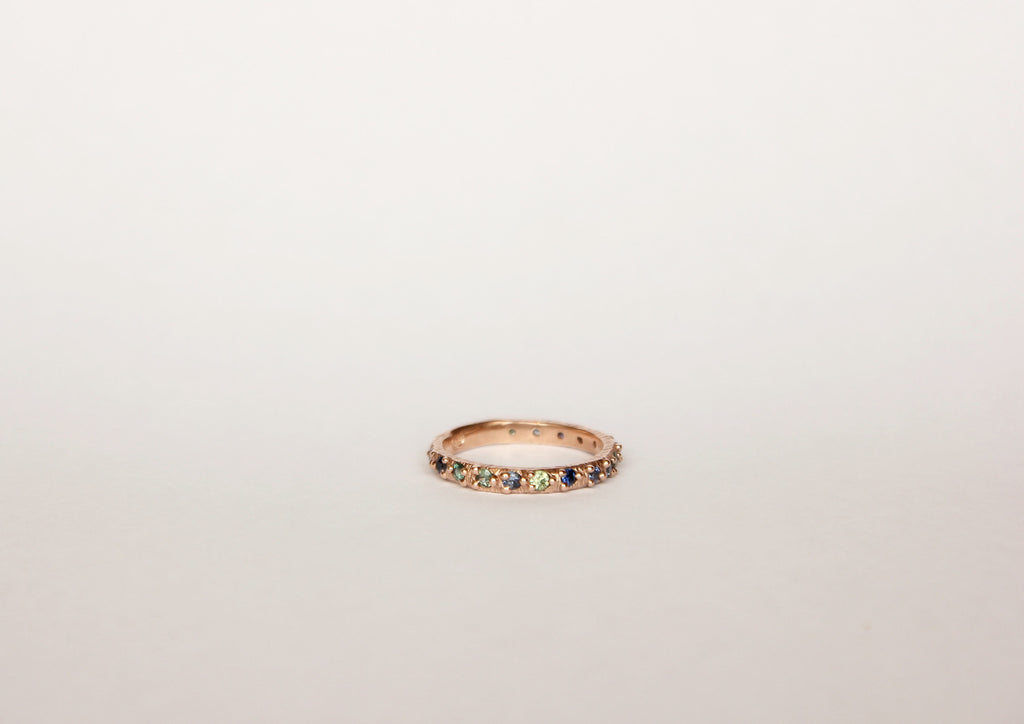 Gold ring band with sapphires